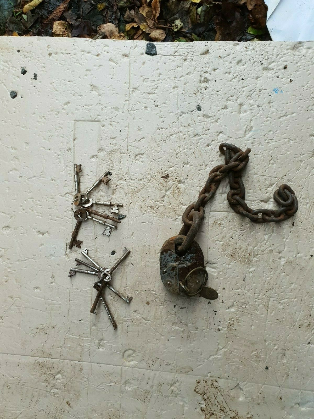 Rusty Old Insurance Padlock And Chain With Two Old Bunches Of Keys Prop ...